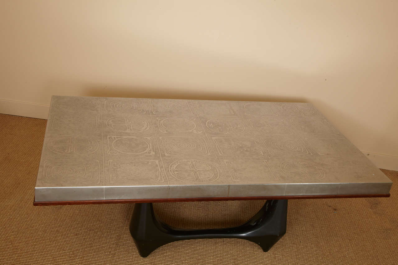 Low table with engraved steel top